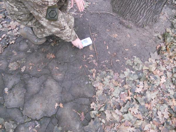 Our tour guide showing how it is more radioactive on the ground
